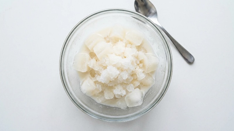 Frozen goat milk slush in glass bowl