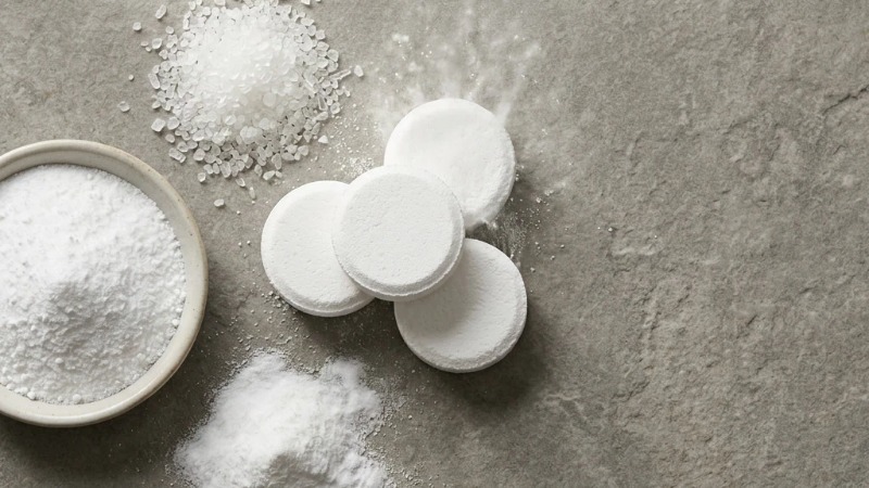Effervescent cleaning tablets and raw ingredients flat lay Effervescent cleaning tablets and raw ingredients flat lay